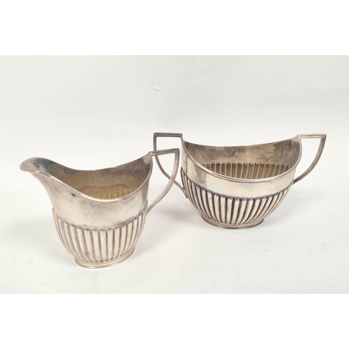 142 - Silver three piece individual tea set of half fluted boat shape, Sheffield, 1895, 412g.