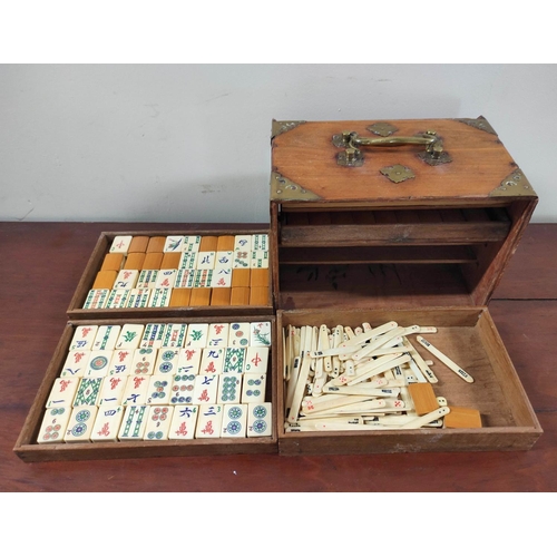 350 - 20th century Chinese Mah-Jong set, the bone tiled pieces contained in a five drawer teak cabinet wit... 