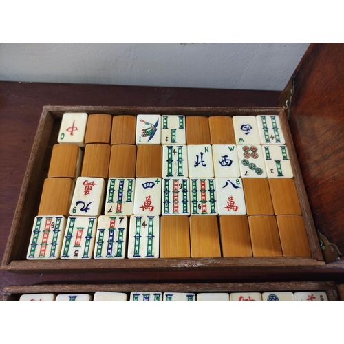 350 - 20th century Chinese Mah-Jong set, the bone tiled pieces contained in a five drawer teak cabinet wit... 