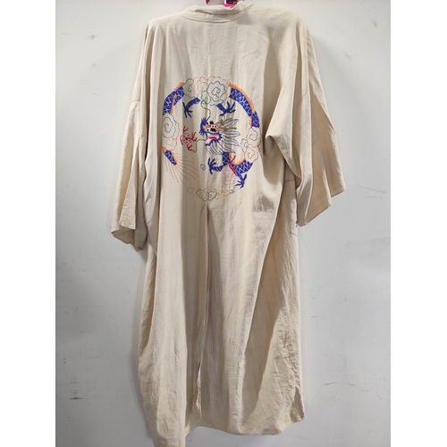 351 - 1920s Chinese silk kimono, decorated with all-over embroidered butterflies and blossoms on blue silk... 