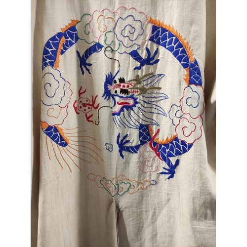 351 - 1920s Chinese silk kimono, decorated with all-over embroidered butterflies and blossoms on blue silk... 