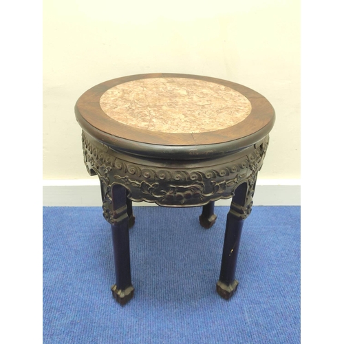 384 - Early 20th century Chinese hardwood jardinière stand, with circular marble inset to the top, above a... 