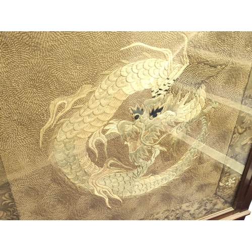 385 - 19th century Chinese silk embroidered panel depicting a dragon chasing the flaming pearl on brown lo... 