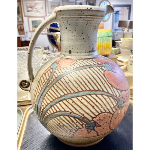 296 - Large decorated stoneware jug, three others, leaf decorated vase and a hardwood stand