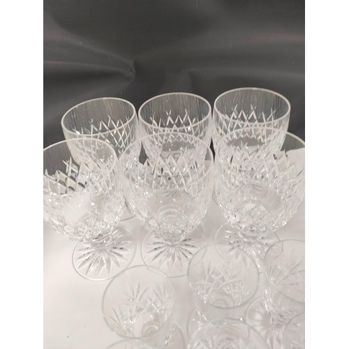 269 - Suite of cut-glass to include six large tumblers, with six smaller, six red and white wine glasses a... 