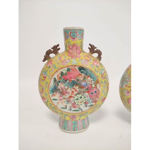 318 - Pair of Chinese famille rose moon flasks, Qianlong revival, possibly Republic period with grotesque ... 