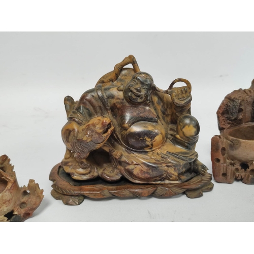 322 - Group of oriental soapstone to include brush washers, another exapmle modeled as a seated Buddha wit... 