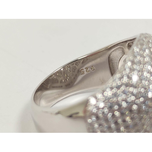 111 - Large silver cocktail ring set with white cubic zirconia.