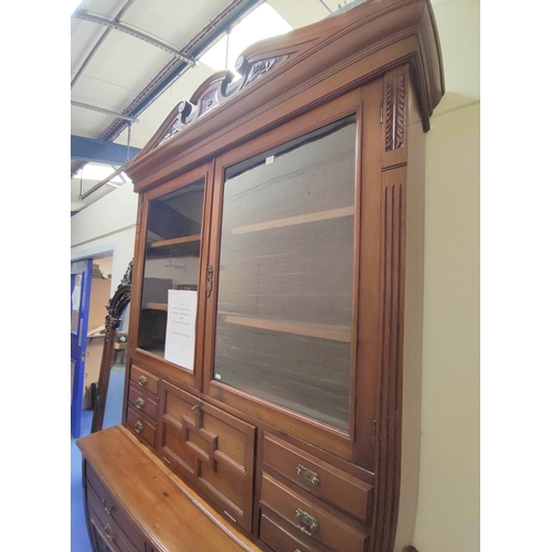 368 - Late Victorian mahogany secretaire bookcase on sideboard base, the bookcase section with scroll corn... 