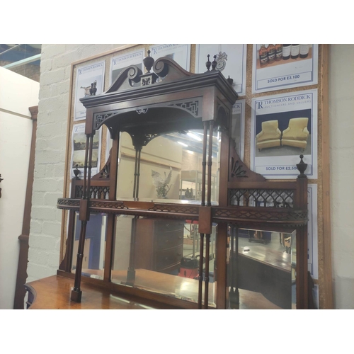 390 - Late Victorian mahogany three tiered mirrored sideboard the cupboard base flanked by two shelves and... 