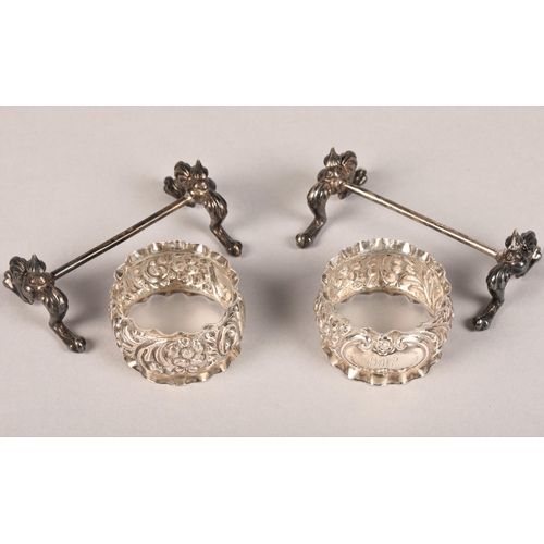 173 - Boxed set of two silver monogrammed napkin rings and two cutlery rests, Birmingham 1897