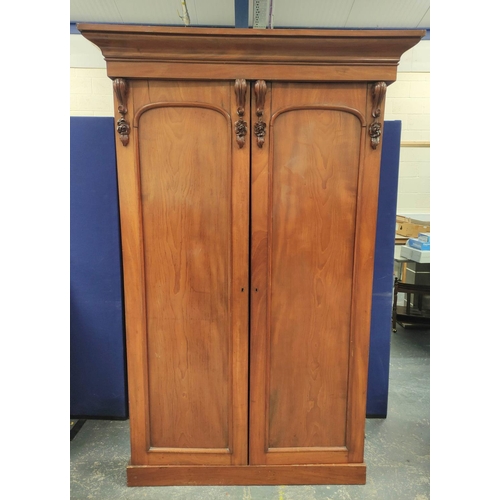 361 - Victorian mahogany wardrobe with detachable cornice above two panelled doors enclosing later hanging... 