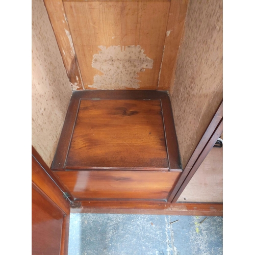 361 - Victorian mahogany wardrobe with detachable cornice above two panelled doors enclosing later hanging... 