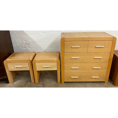 574 - Contemporary three piece pine bedroom set, two over three dresser and two bedside tables (3)