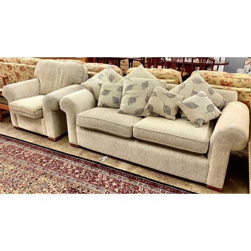 595 - Two seater sofa with matching arm chair. (2)