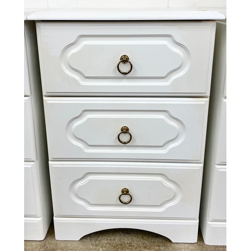 621 - White  bedroom suite comprising of five bedside cabinets and a dressing table with cheval mirror