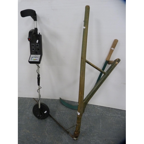 343 - Two scythes and a metal detector.