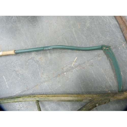 343 - Two scythes and a metal detector.