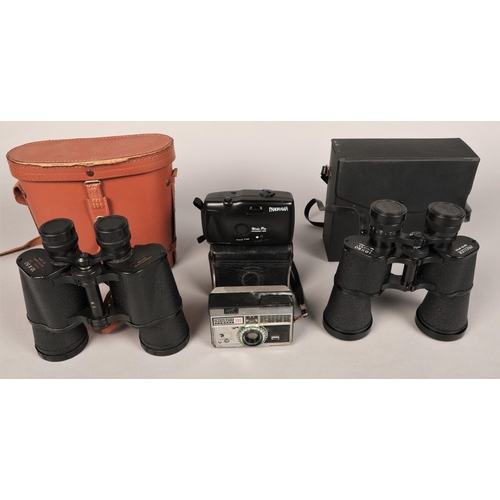 394 - Two sets of binoculars and various cameras