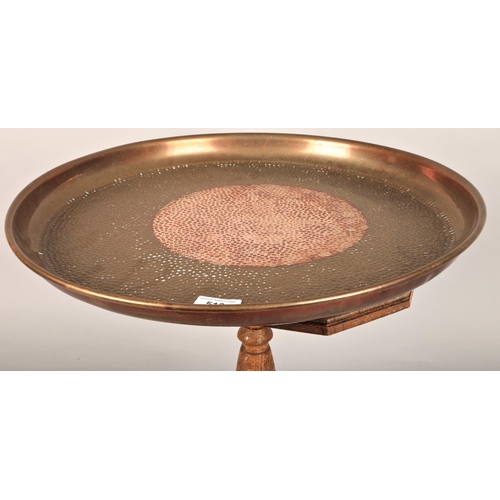 513 - Hammered copper tray (46cm d) on small oak coffee table