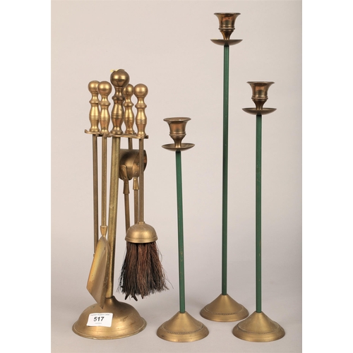 517 - Brass companion set and three candlesticks