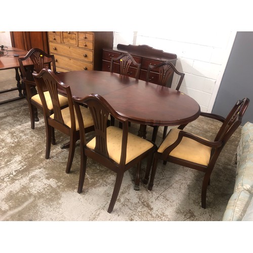 582 - Dining room suite including extendable dining room table with matching sideboard, two carvers and fo... 