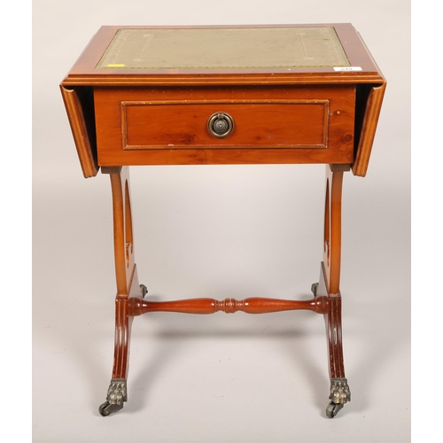 549 - Drop leaf yew side table, with green leather embossed top 