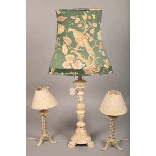 622 - Large paw footed carved wooden table lamp with green floral bird pattern shade, and two smaller matc... 