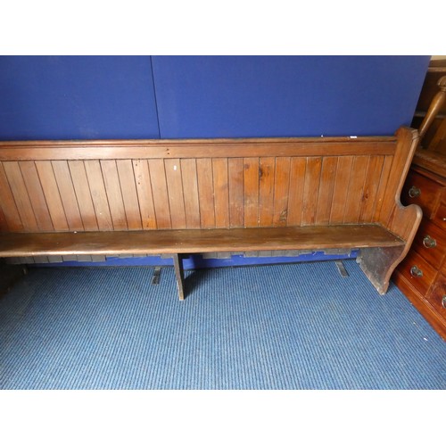 394 - Antique pitch pine pew, boarded back & solid seat, 277cms long.