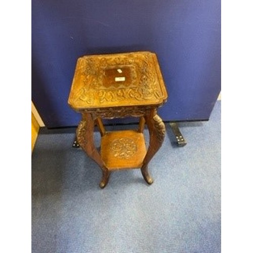 397 - Oriental plant table, c.1920`s, the square top with indented corners, carved in relief with dragons ... 