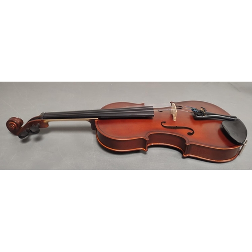 69 - Modern 3/4 size violin unattributed. Oil varnished spruce top and two piece maple back. Complete wit... 