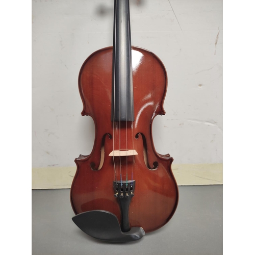 70 - Modern 4/4 size violin unattributed. Spruce top and two piece maple back. Complete with case and bow... 