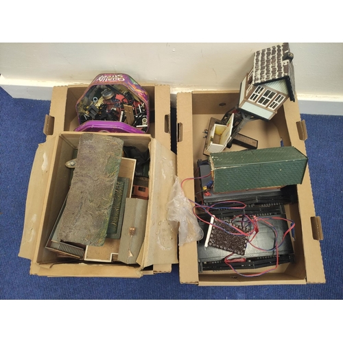 83 - Two boxes of model railway buildings and components to include signal box etc. (2)