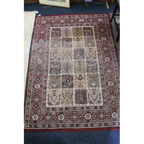 567 - Ikea red and beige ground multi-border rug, 190 x 130cm.