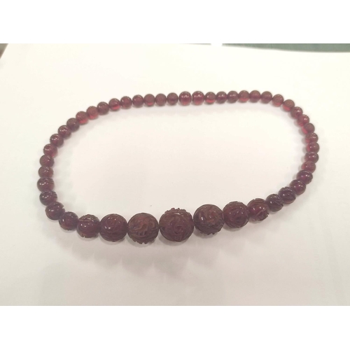 133 - Three amber necklets and a similar bracelet, part, gross 142g.  (4).