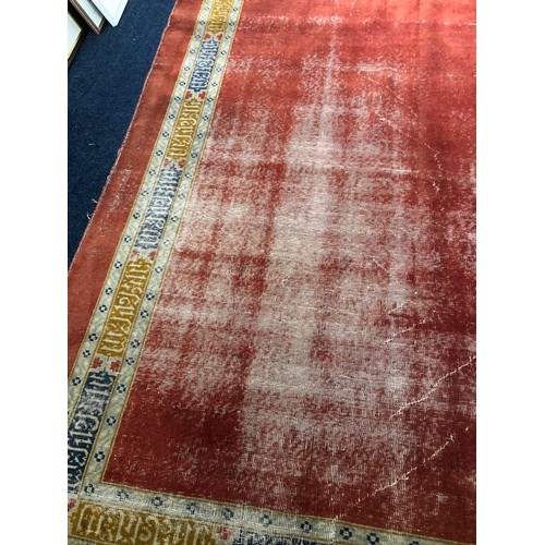 561 - Large hand woven carpet, well-worn in places, some damage, 484 cm x 336cm.