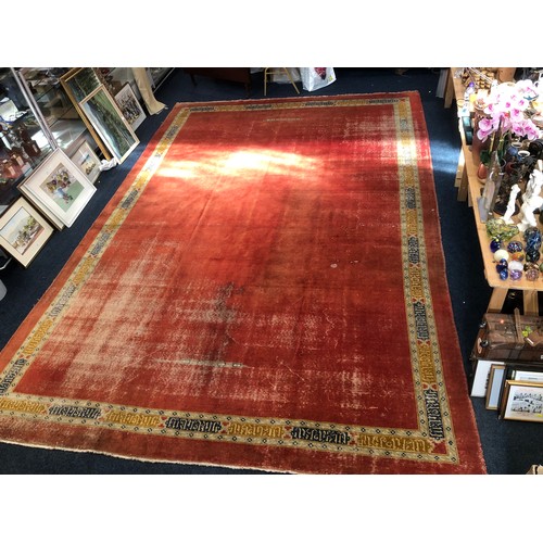 561 - Large hand woven carpet, well-worn in places, some damage, 484 cm x 336cm.