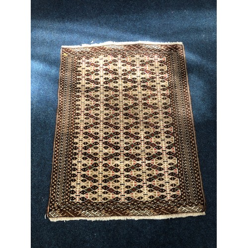 562 - Caucasian style rug with over geometric design, 134 x 102cm.