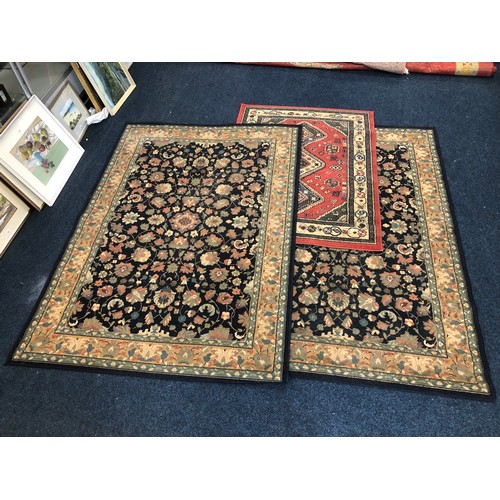 564 - Pair of rugs with foliate design, 225 x 160cm, and another.