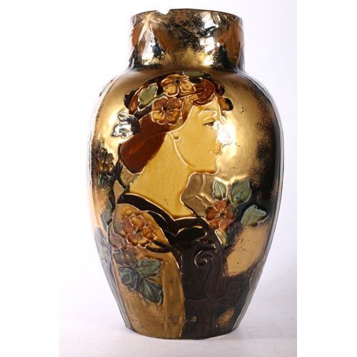 20 - Art Nouveau glazed pottery vase with female bust and foliage decoration, 31cm.