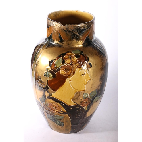 20 - Art Nouveau glazed pottery vase with female bust and foliage decoration, 31cm.