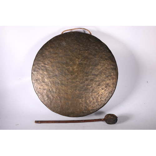 101 - Metal gong and beater, 47cm diameter.