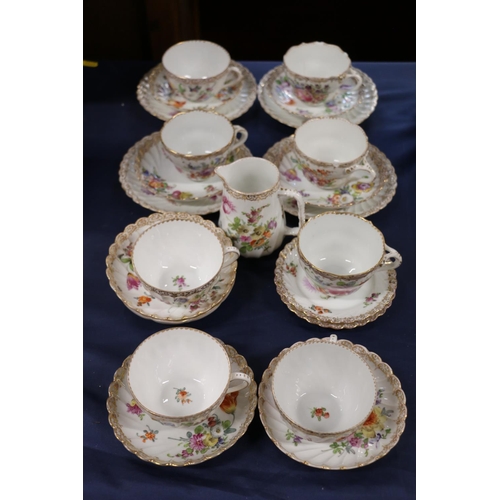 68 - Dresden teaset with cups, saucers, plates, and a milk jug.