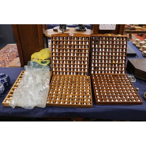 85 - Large collection of porcelain thimbles, with display cabinets.