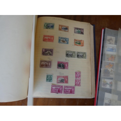 133 - Two albums of world postage stamps to include Southern Rhodesia.