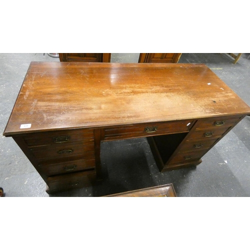 439 - Edwardian oak desk  fitted seven drawers, 136cm.