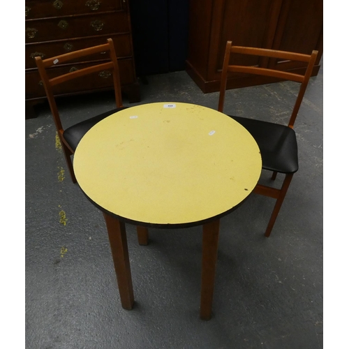 459 - Circular table and two chairs.