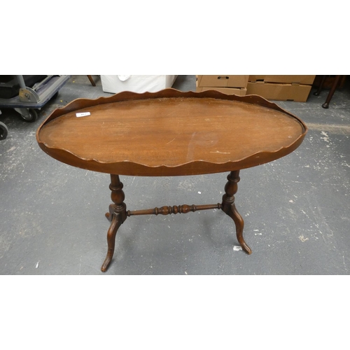 467 - Small oval mahogany tray top coffee table.