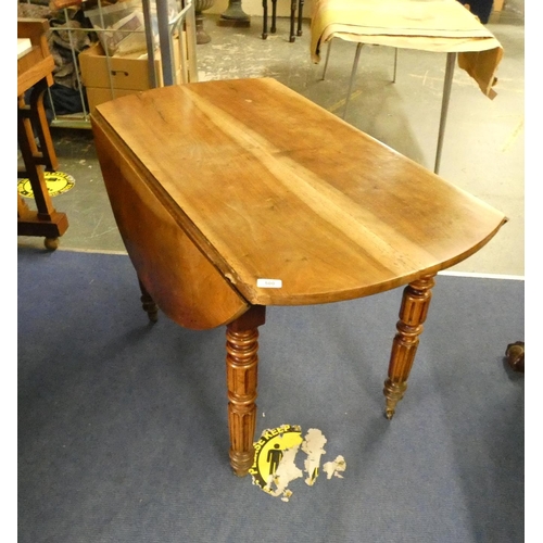 500 - Antique cherry wood circular drop leaf dining table.