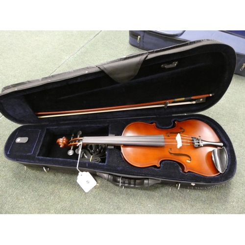 69 - Modern 3/4 size violin unattributed. Oil varnished spruce top and two piece maple back. Complete wit... 